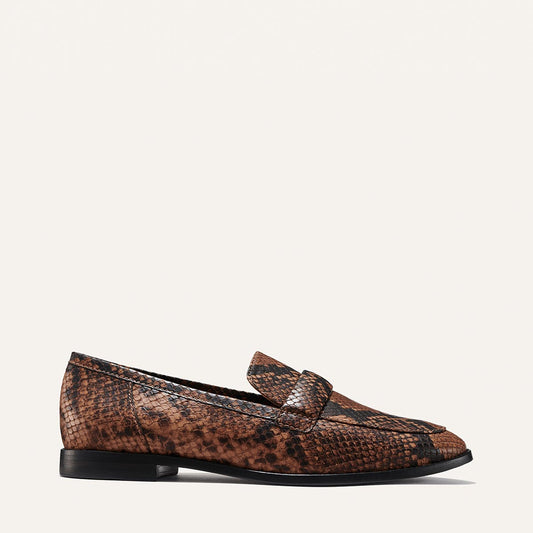 Margaux's structured Andie Loafer, made in a brown python-embossed leather with a plush, padded keeper 