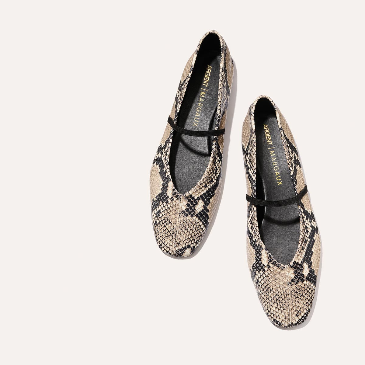 The Phoebe - Natural Python Embossed by margaux-development: womens ballet flats in beige and black python-embossed leather, sacchetto construction for flexibility, with a single black strap, shown on a plain light background.