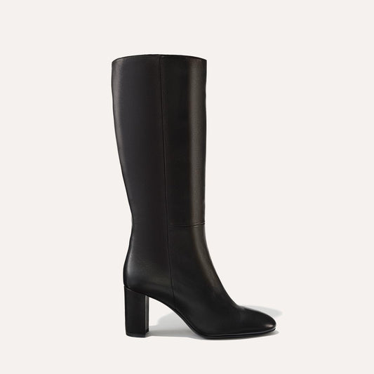 Margaux's knee-high Bleecker Boot in soft, black Italian lambskin with walkable heel and almond-shaped toe