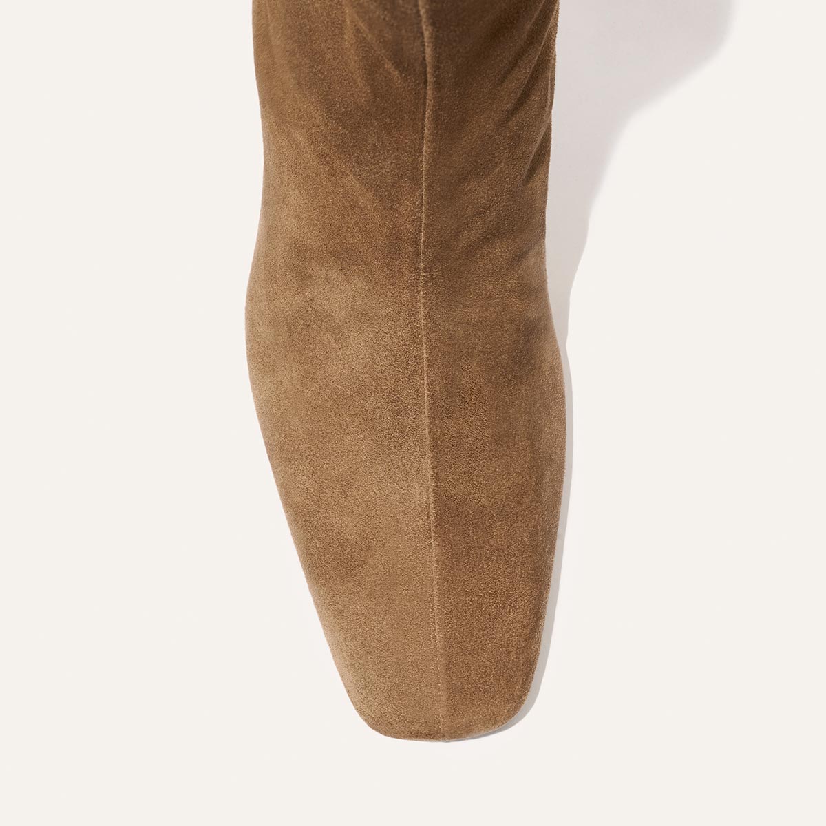 Top-down view of Margaux’s The Brera Boot in Driftwood Suede, featuring a square toe, photographed against a plain white background.