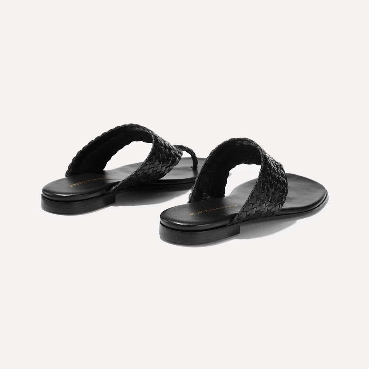 Black woven leather thong sandals