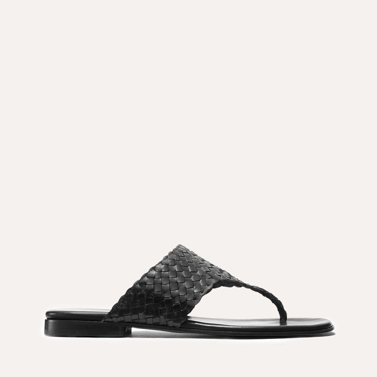 Black woven leather thong sandals