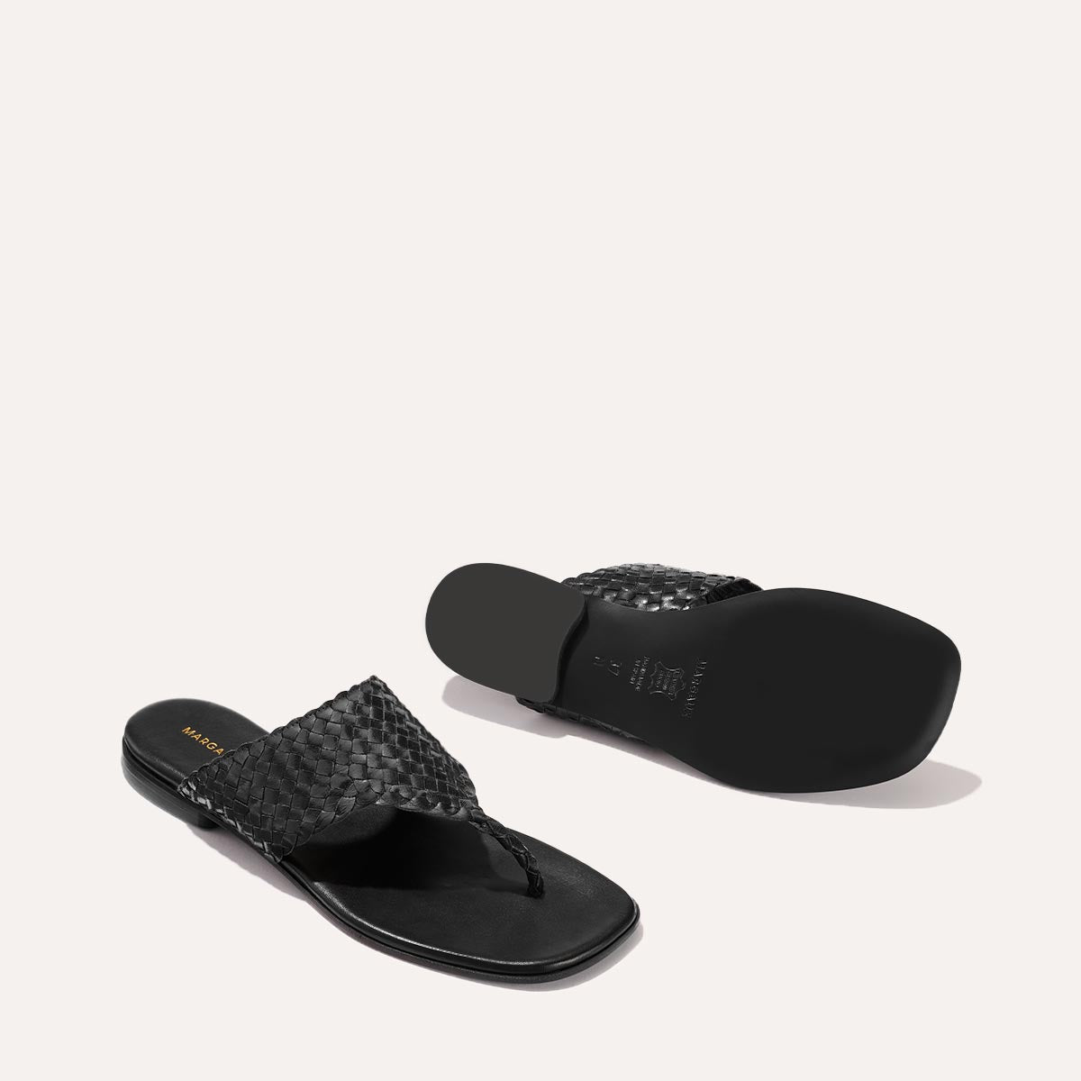 Black woven leather thong sandals