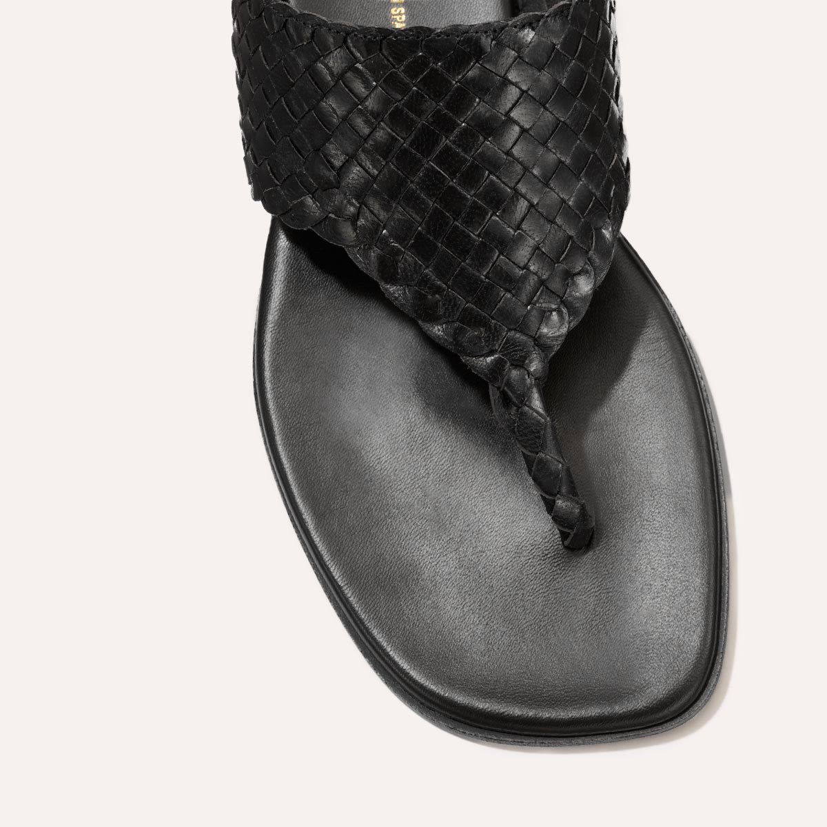 Black woven leather thong sandals