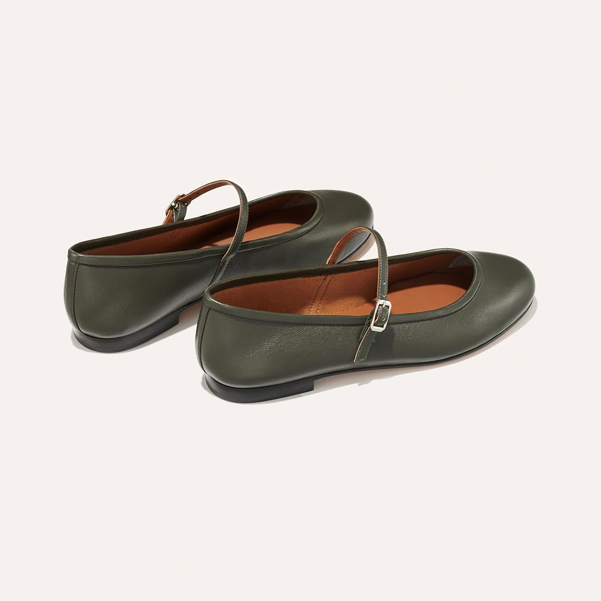 The Demi Jane in olive green nappa, a ballet flat with a rounded toe and an adjustable strap for a secure fit.