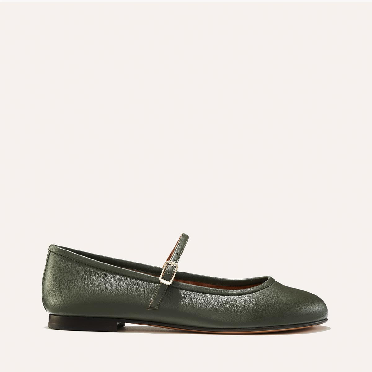 The Demi Jane in olive green nappa, a ballet flat with a rounded toe and an adjustable strap for a secure fit.