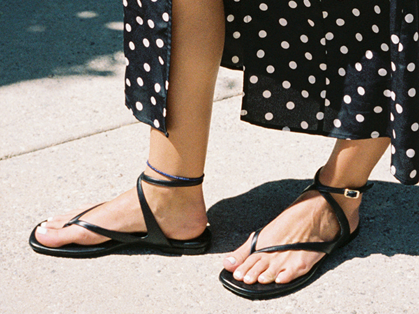 The Palermo Sandal in Black Nappa worn with a Ciao Lucia dress