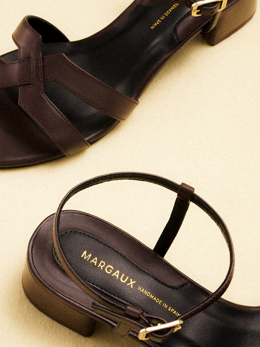 Low heeled sandals shown in python, espresso and black leather