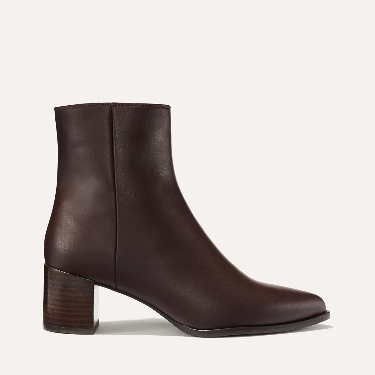 The Downtown Boot - Espresso Calf by Margaux is a dark brown western ankle boot with a rounded toe and stacked block heel, displayed in side profile on an off-white background.