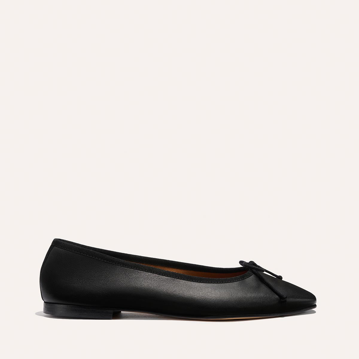 The Fonteyn - Black Nappa by Margaux is a handcrafted black ballet flat with a bow, designed for a comfort-first fit.