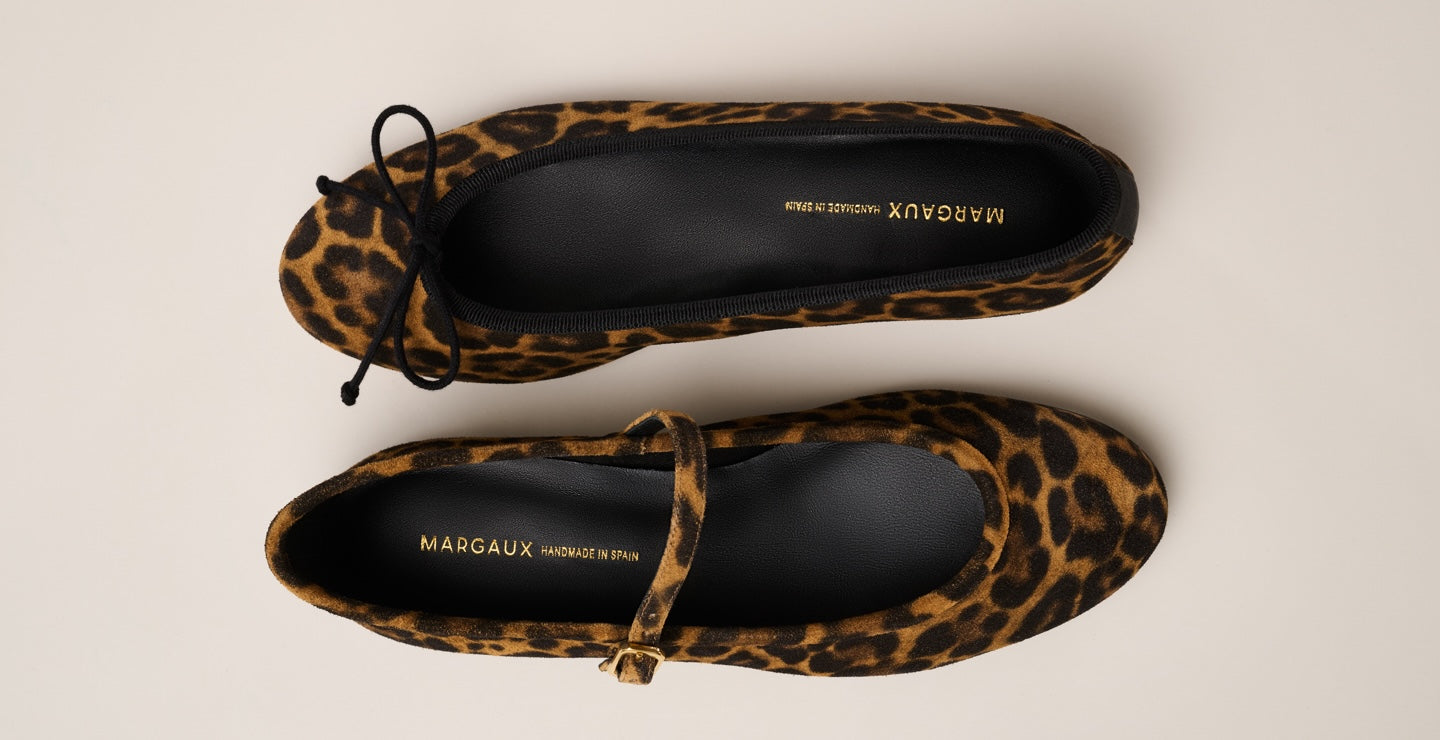Two leopard print ballet flats, one with a bow and one with a strap, placed side by side on a light beige background. The insoles display the brand name Margaux.