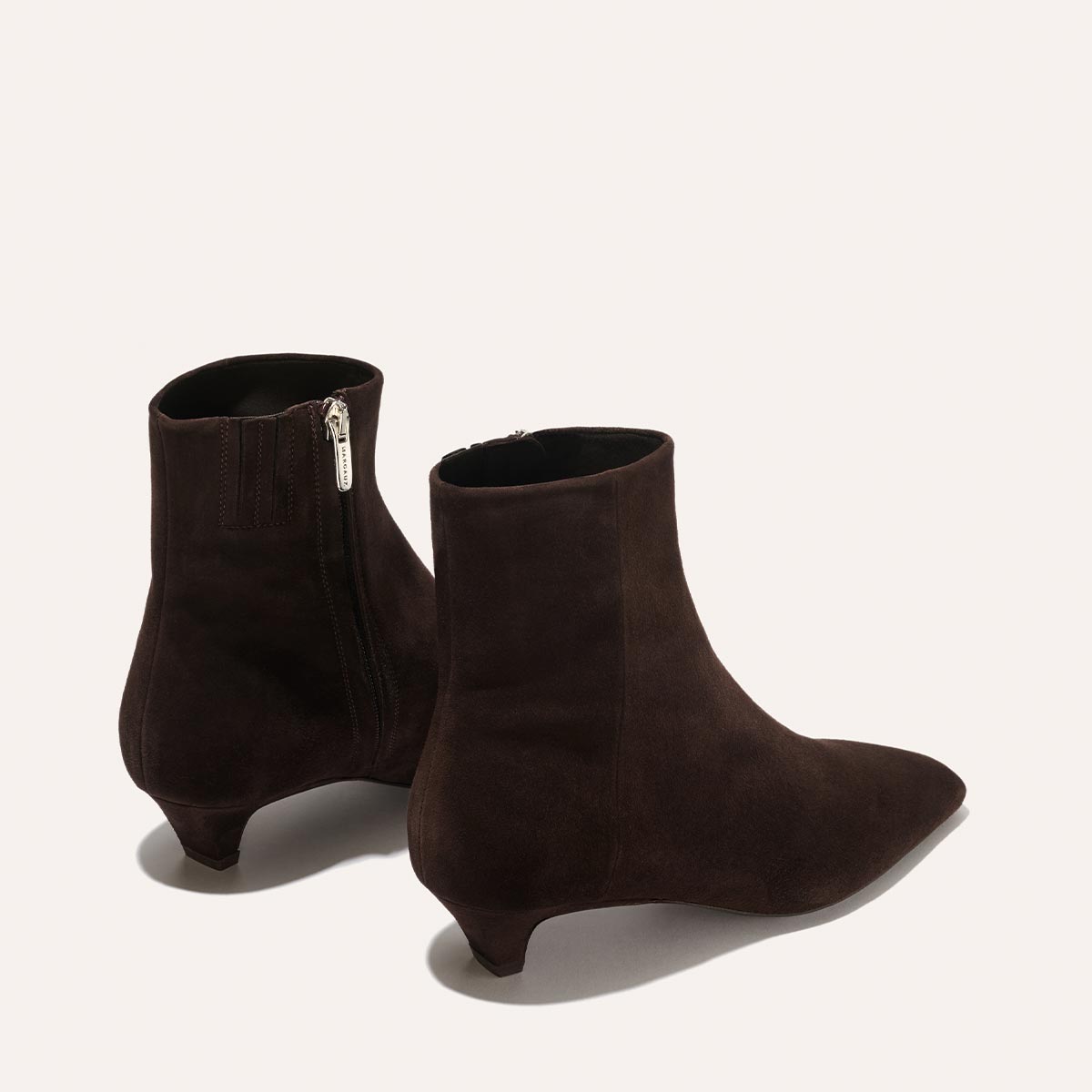 The Alex Mill x Margaux: The Inga - Espresso Suede boots by margaux-development feature pointed toes, short kitten heels, and side zippers in rich espresso suede—ideal for stylish walks through the city.