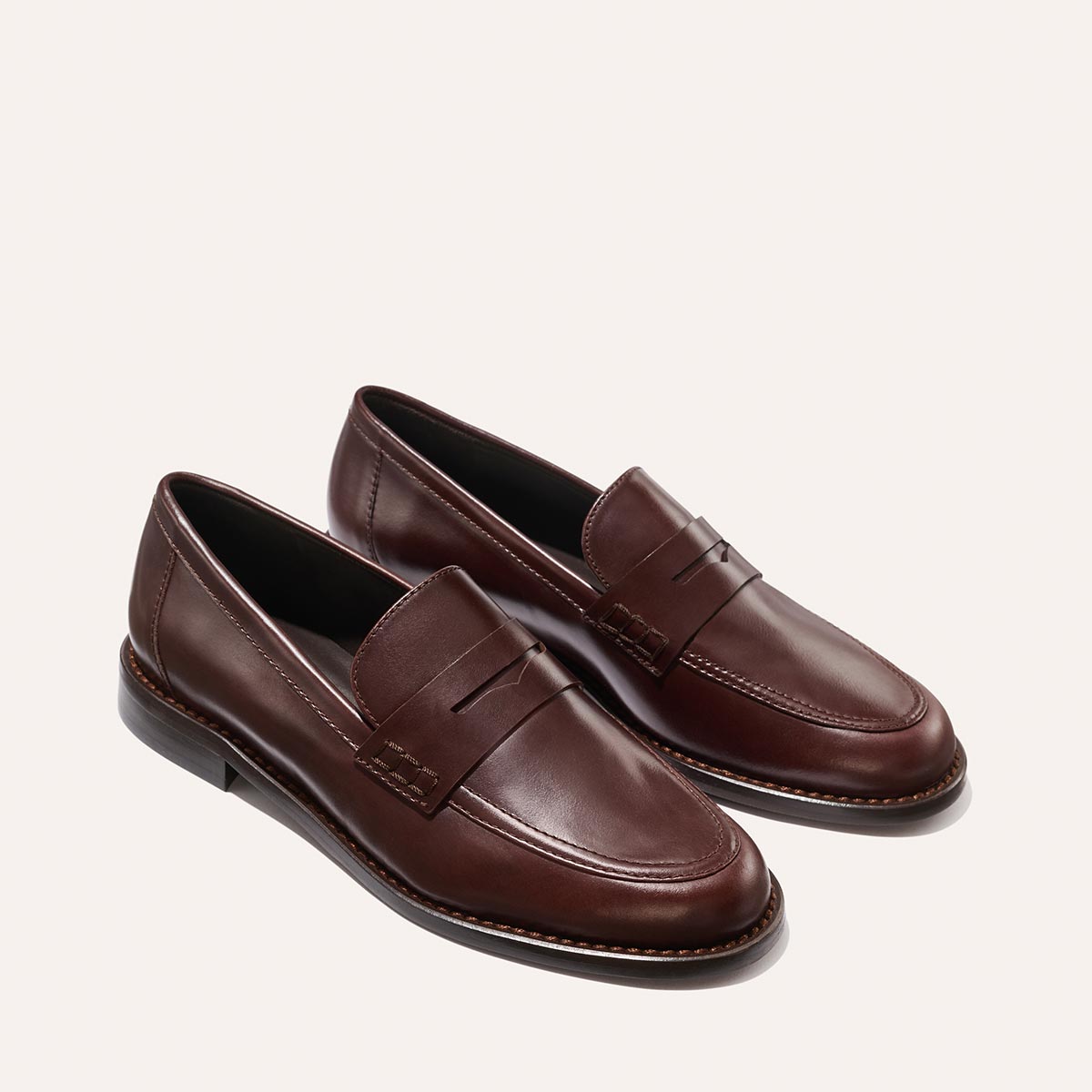 The Marlowe Loafer - Mahogany Calf by Margaux: men's brown leather loafers featuring stitching details and a low heel, shown on a light background.
