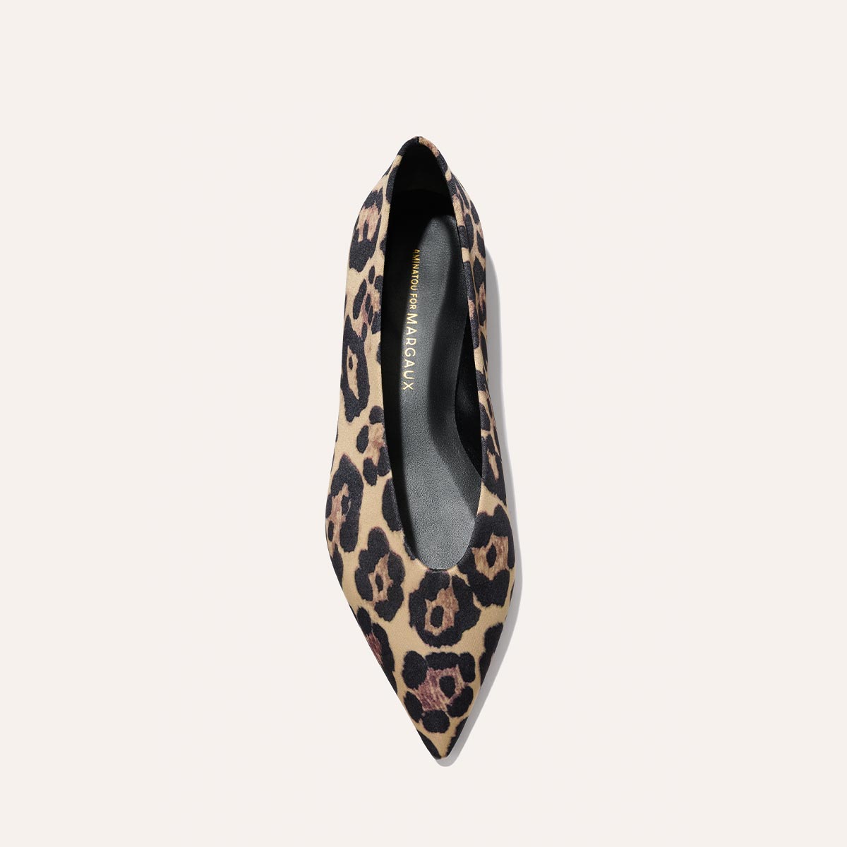 The Parra - Leopard Satin by margaux-development: a pointed-toe flat in beige and black leopard satin, viewed from above on a light background. The black insole features gold branding.