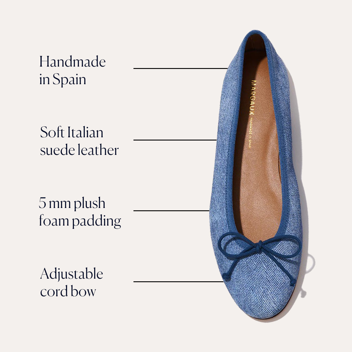 The Demi - Denim Suede by margaux-development is a blue ballet flat handmade in Spain from soft Italian suede, with 5mm plush foam padding, an adjustable cord bow, and a tan insole accented by elegant gold branding.