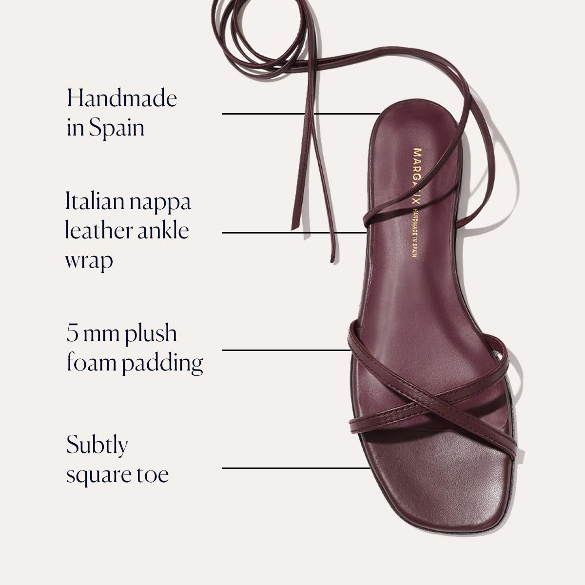 The Wrap Sandal - Burgundy Nappa by margaux-development features rich Italian nappa leather, crisscross and ankle wrap straps, a subtly square toe, and 5mm foam padding. Handcrafted in Spain for elegant style and all-day comfort.