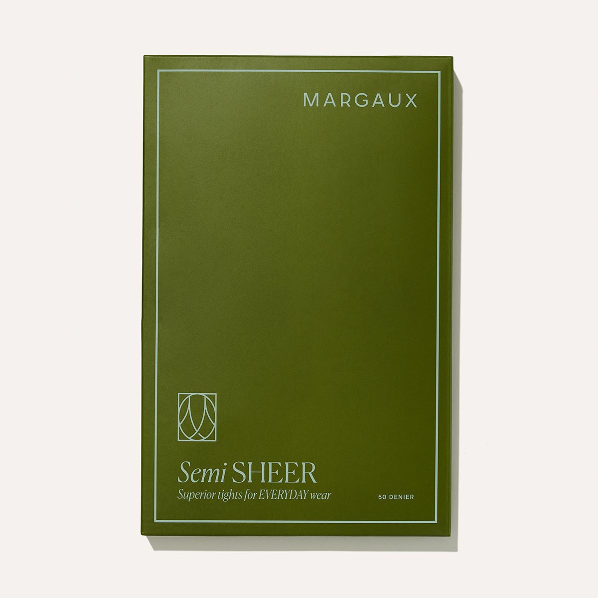 Olive green Margaux packaging for Semi-Sheer Tights - Black features white minimalist text and border. The label reads: “Semi SHEER Superior tights for EVERYDAY wear” with “50 DENIER” at the bottom right—perfect with Margaux boots.