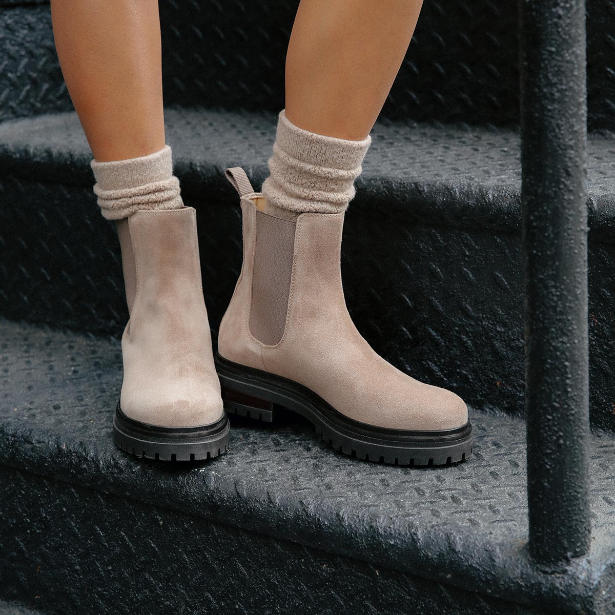 The West Chelsea Boot in Sandstone Suede, featuring water-resistant suede with a rubber lug sole for added traction and versatility.