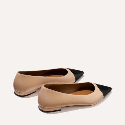 The Alba - Dune and Black Nappa by Margaux: beige ballet flats with black pointed toe caps and a padded insole, displayed on a light background.