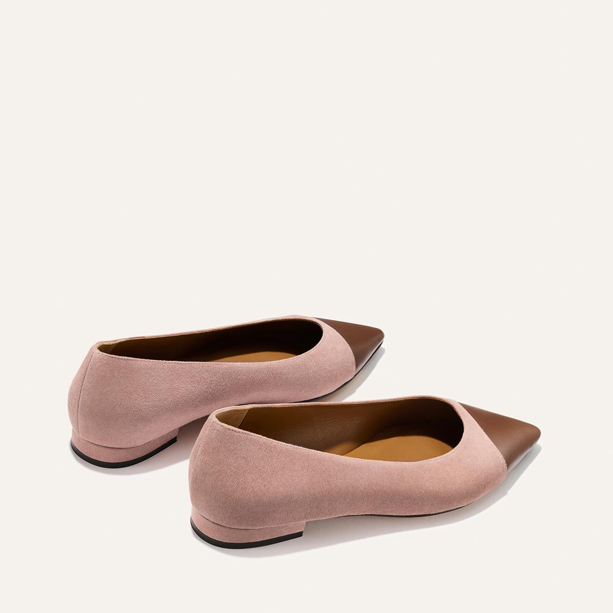 The Alba - Dusty Rose Suede by Margaux: women’s ballet flats with pointed brown leather toes, padded insoles, and soft pink suede sides and heels, displayed against a plain light background.