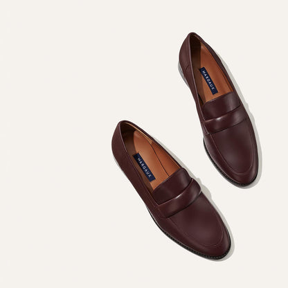 The Andie Loafer in Burgundy Nappa, featuring a sleek structured design made from smooth Italian nappa leather with a minimalistic padded keeper detail.