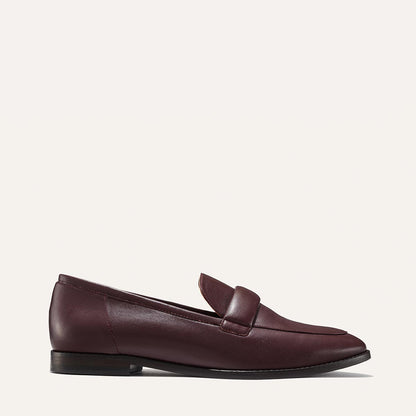 The Andie Loafer in Burgundy Nappa, featuring a sleek structured design made from smooth Italian nappa leather with a minimalistic padded keeper detail.