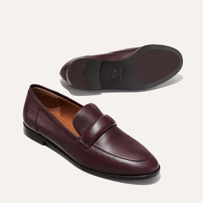 The Andie Loafer in Burgundy Nappa, featuring a sleek structured design made from smooth Italian nappa leather with a minimalistic padded keeper detail.