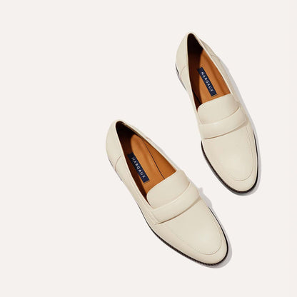 The Andie Loafer in Ecru Nappa, featuring a sleek structured design made from smooth Italian nappa leather with a minimalistic padded keeper detail.