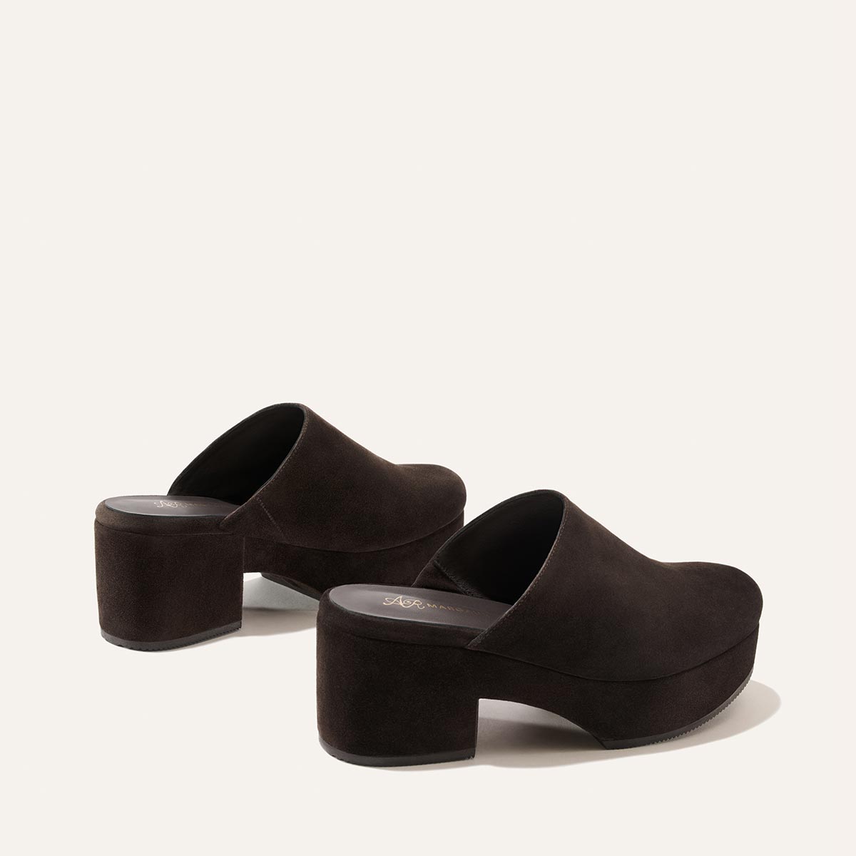 A pair of The Atlantic Clog in Dark Chocolate Suede by Margaux, featuring platform soles and chunky block heels, displayed on a plain white background.