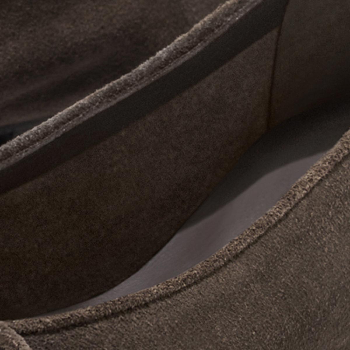 Close-up of Alison Roman x Margaux: The Salamanca - English Brown Suede flats by Margaux, highlighting textured suede, visible stitching, and detailed inner and outer edges.