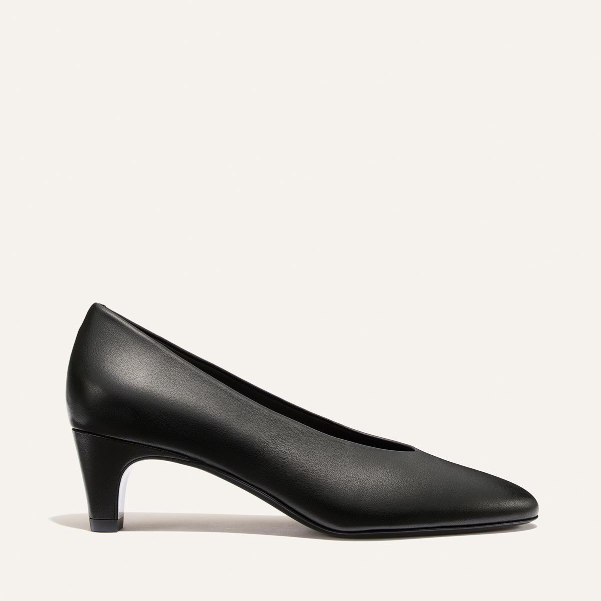 The Augusta Glove Pump by Margaux in Black Nappa is displayed in a side profile against a plain light background.