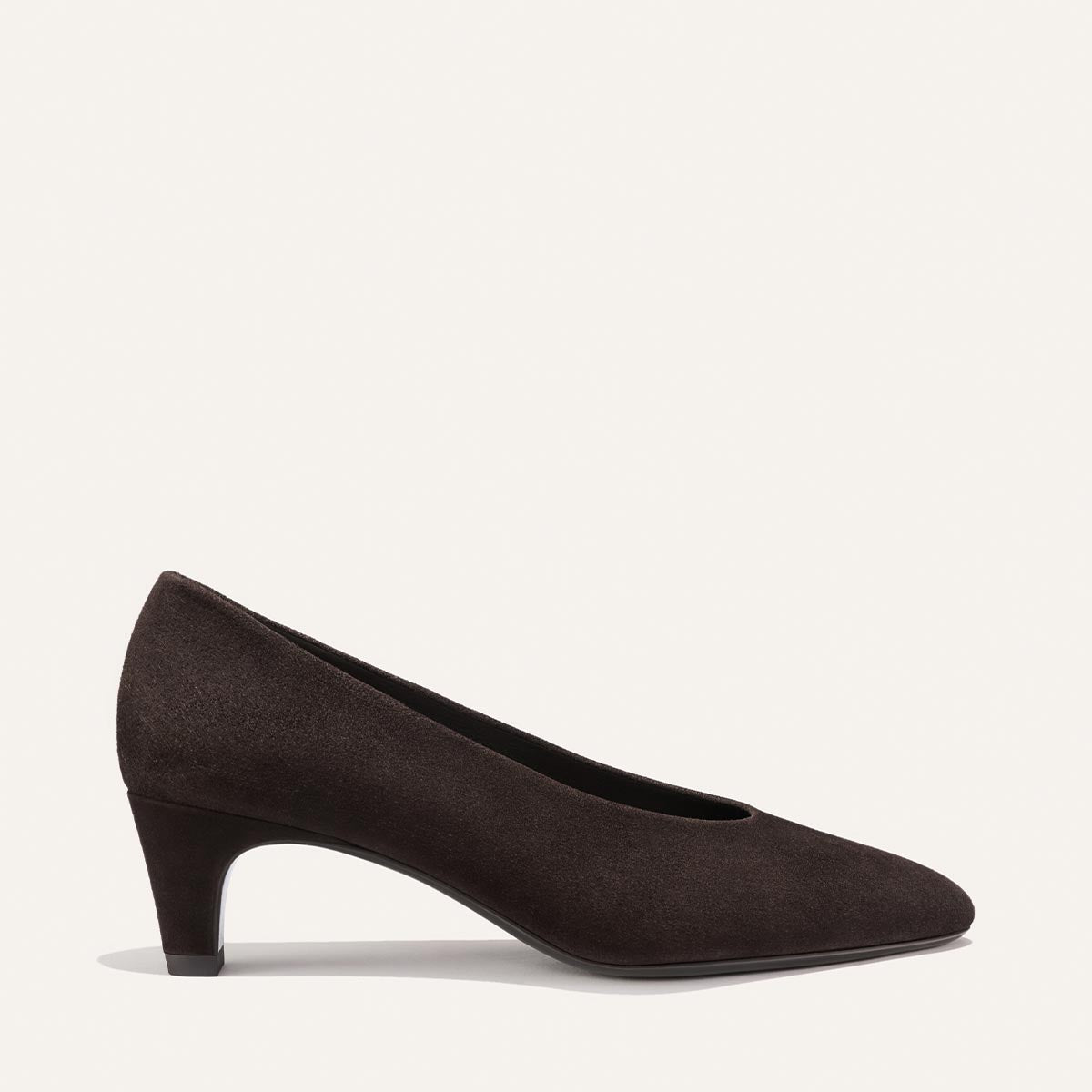 The Augusta Glove Pump in Molasses Suede by Margaux is displayed on a plain light background, shown from the side.