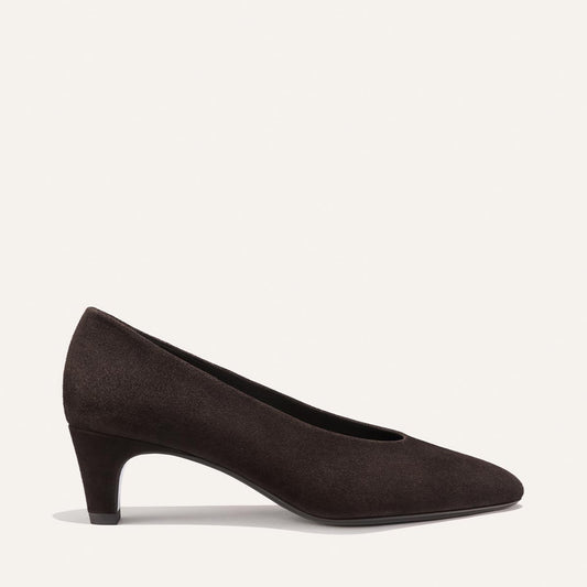 The Augusta Glove Pump in Molasses Suede by Margaux is displayed on a plain light background, shown from the side.