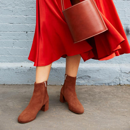 The Boot in Brandy Suede, featuring an elegant almond toe and block heel, crafted from high-quality Italian leather for a timeless and modern look.
