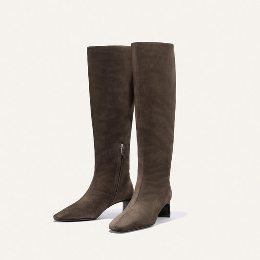 Margaux’s The Brera Knee-High Boot in English Brown Suede featuring a square toe and a walkable block heel.