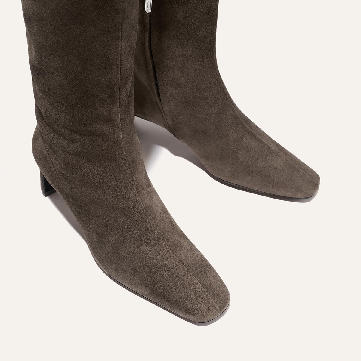 The Brera Knee-High Boot in English Brown suede, featuring a square toe and a walkable low block heel.