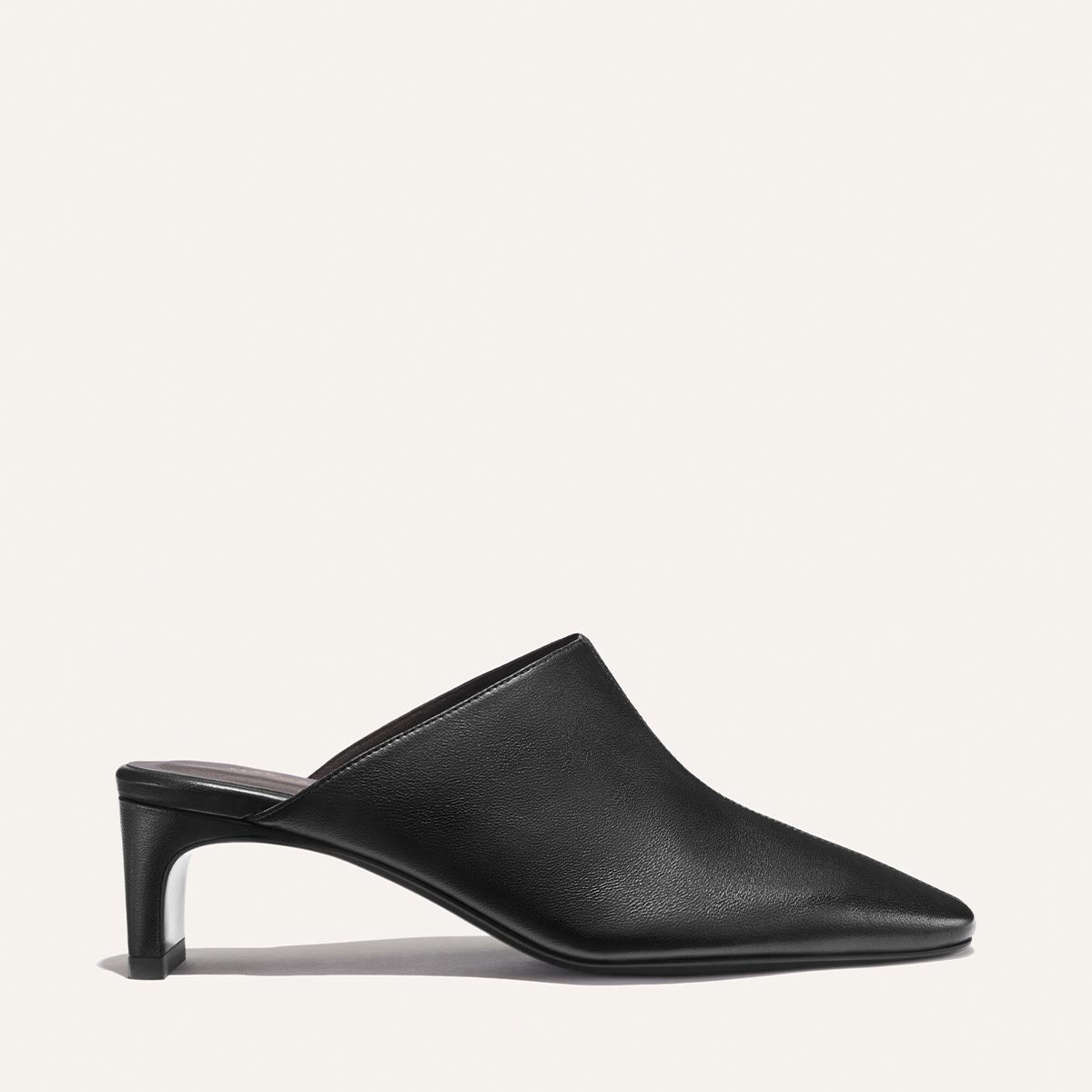 The Brera Mule - Black Nappa by Margaux, featuring a pointed toe and mid-height heel, is displayed in a side profile view against a plain, light background.