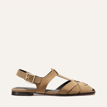 Tan sandal with a strap on a white background