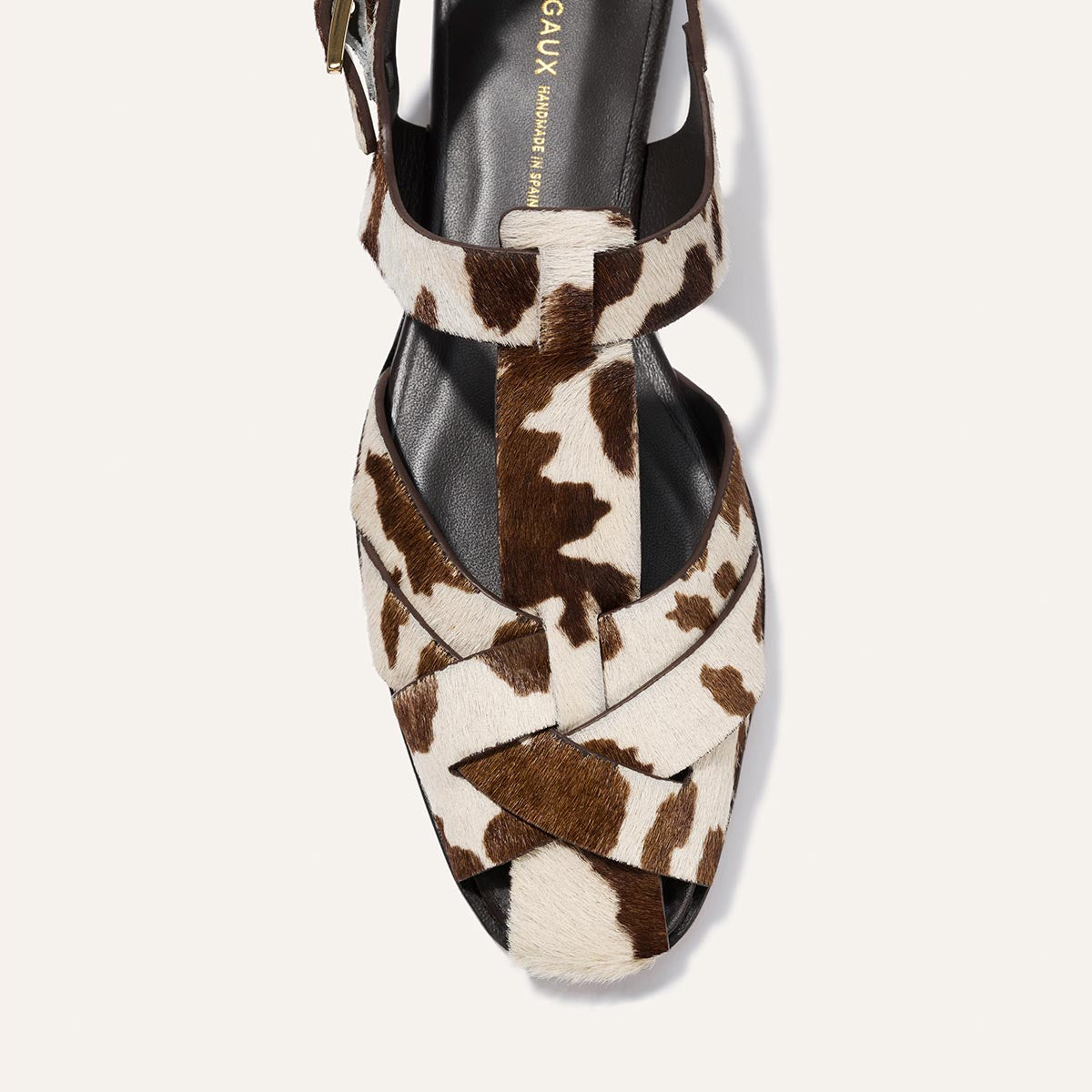 Cow print sandal on a white background