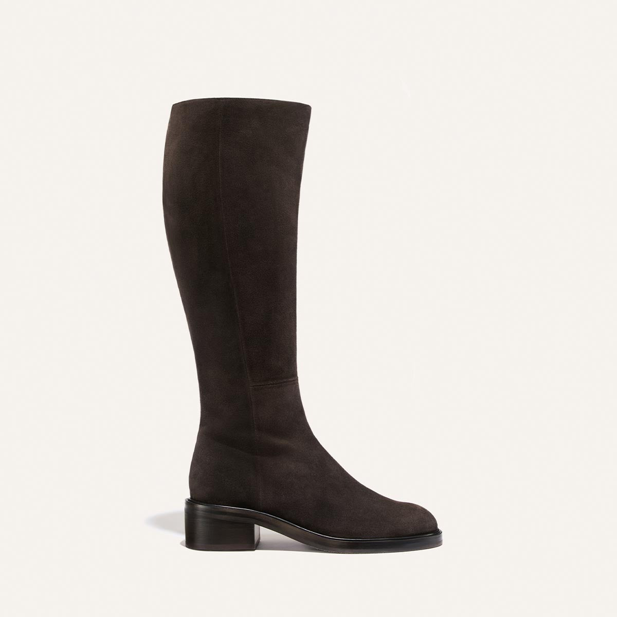 The City Boot - Dark Chocolate Suede riding boots feature a knee-high silhouette and a low block heel.