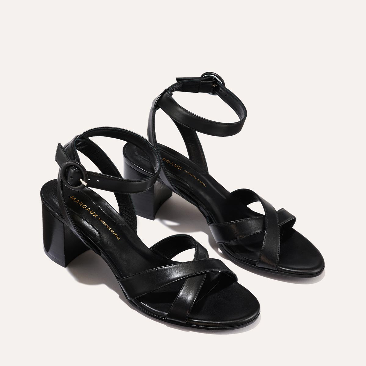 The City Sandal in Black Nappa, featuring carefully placed straps, an adjustable ankle strap and a comfortable 2.5-inch block heel.