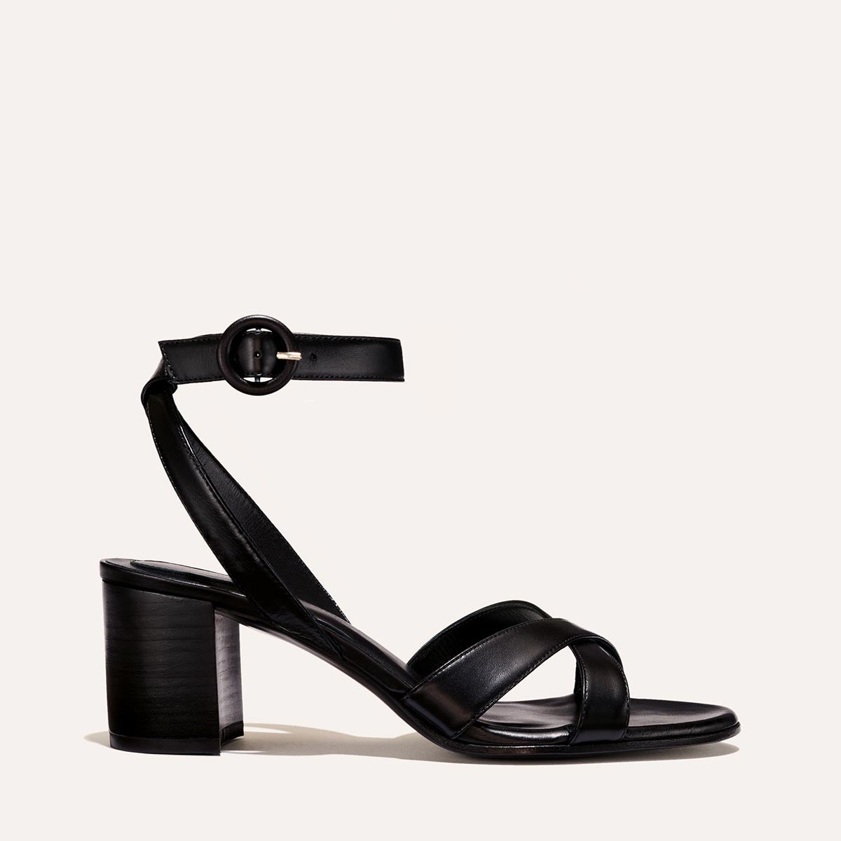 The City Sandal in Black Nappa, featuring carefully placed straps, an adjustable ankle strap and a comfortable 2.5-inch block heel.