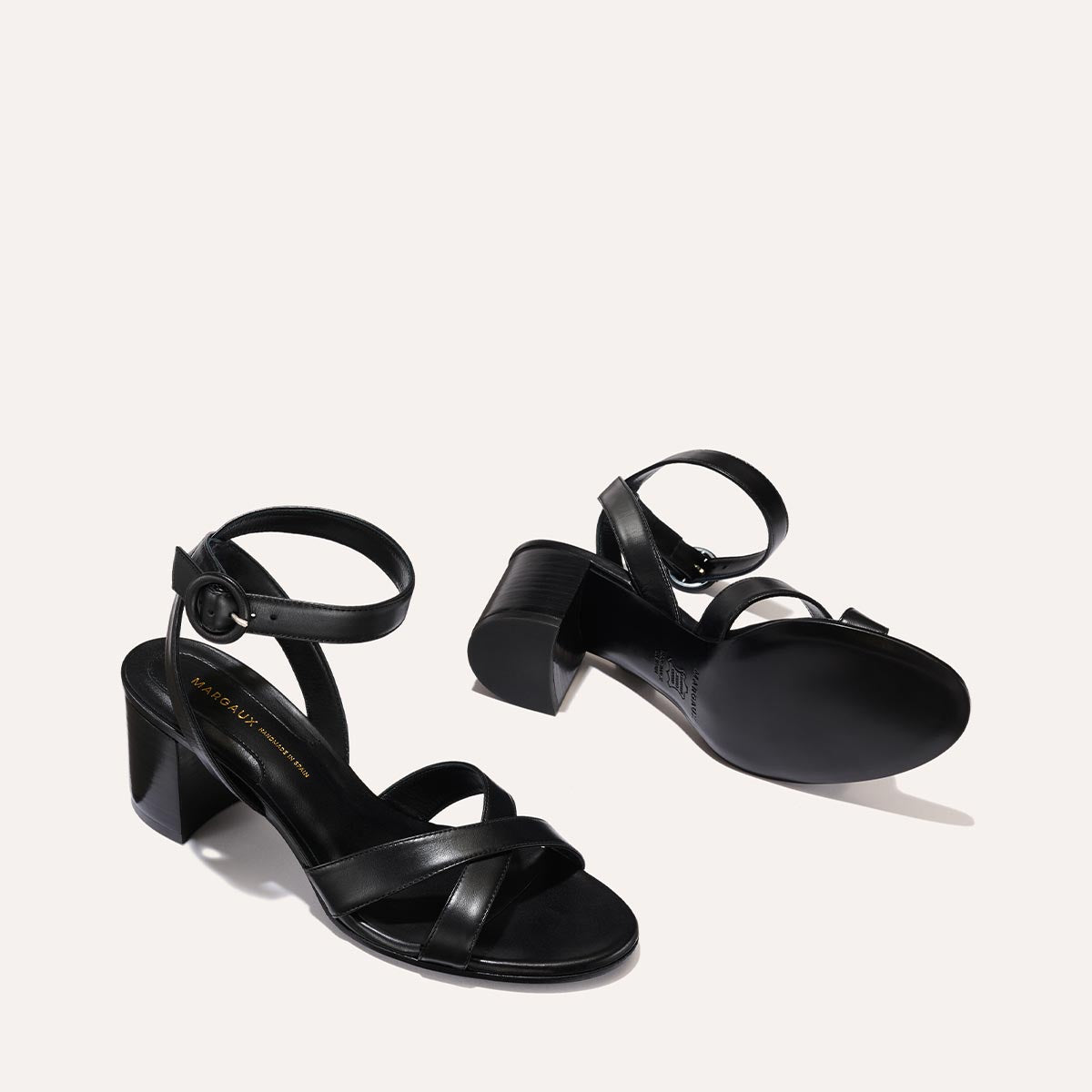 The City Sandal in Black Nappa, featuring carefully placed straps, an adjustable ankle strap and a comfortable 2.5-inch block heel.