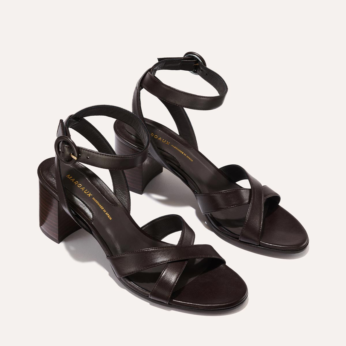 The City Sandal in Espresso Nappa, featuring carefully placed straps, an adjustable ankle strap and a comfortable 2.5-inch block heel.