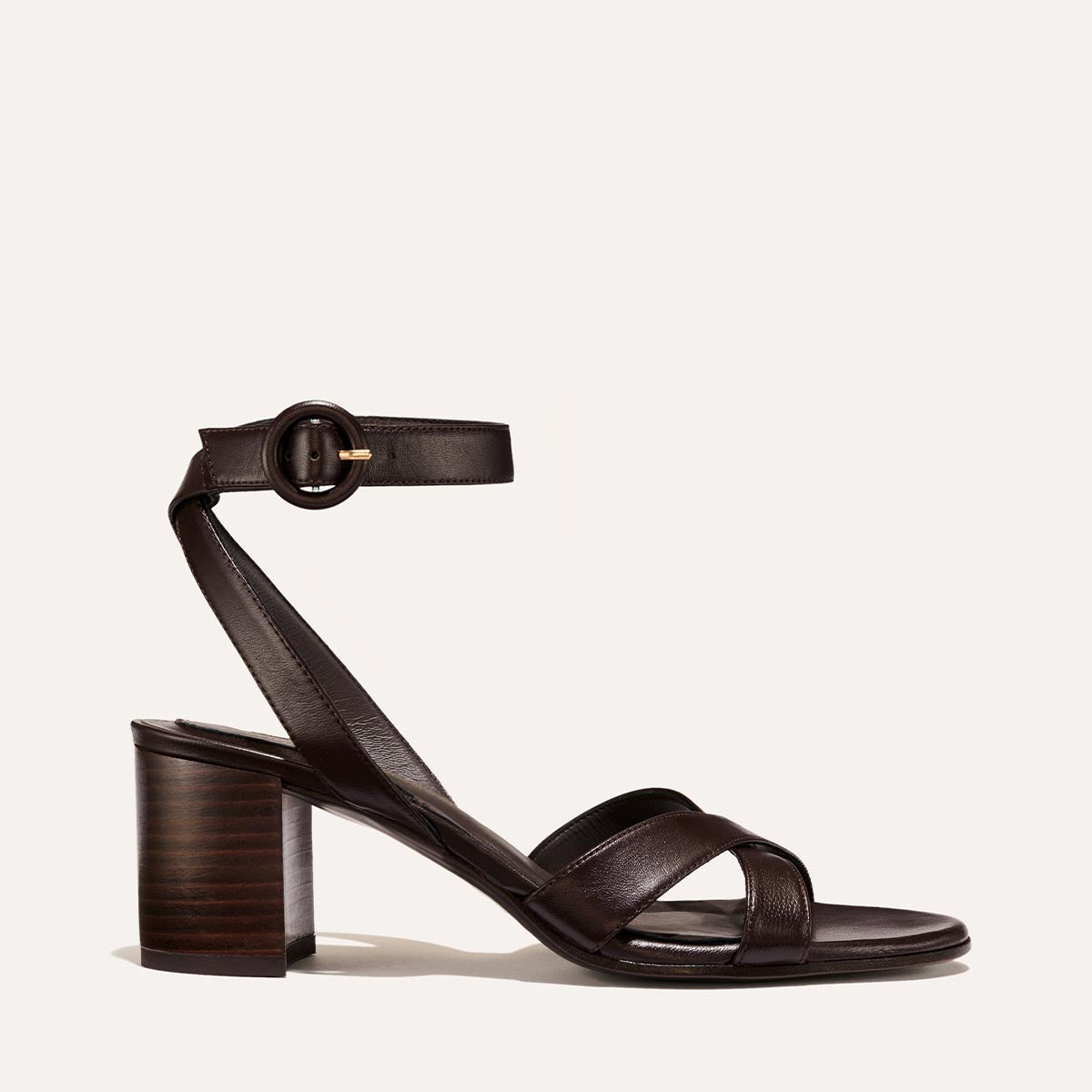 The City Sandal in Espresso Nappa, featuring carefully placed straps, an adjustable ankle strap and a comfortable 2.5-inch block heel.