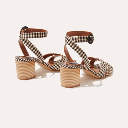 The City Sandal - Tan and Black Gingham by margaux-development features block heels, black and white gingham straps with ankle buckles, tan stacked heels, and a cushioned insole for comfort, shown against a white background.