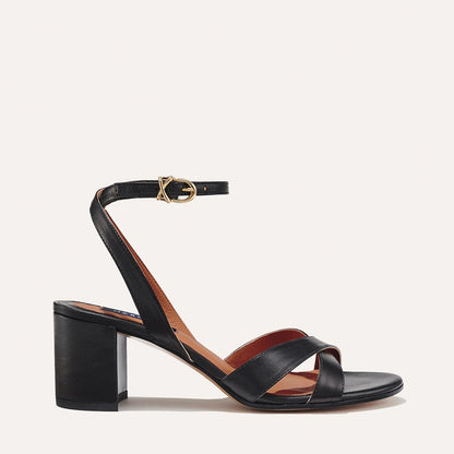 The City Sandal in Black Nappa, featuring carefully placed straps, and adjustable ankle strap and a comfortable 2.5-inch block heel.