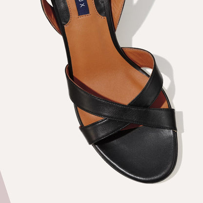 The City Sandal in Black Nappa, featuring carefully placed straps, and adjustable ankle strap and a comfortable 2.5-inch block heel.