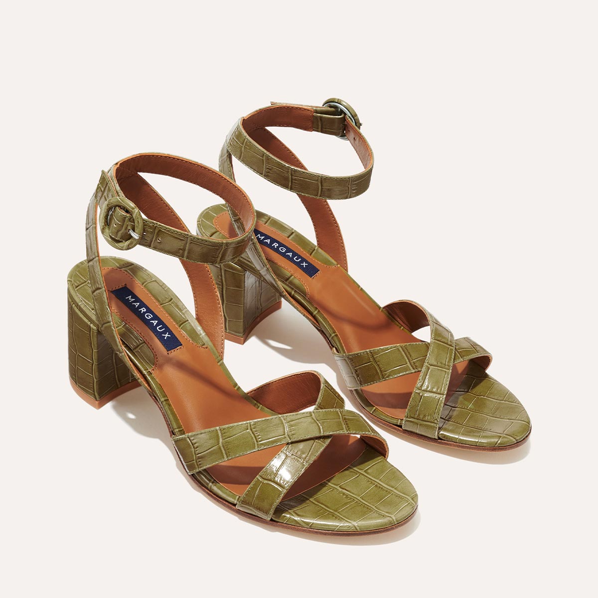 Margaux's classic City Sandal in olive green croc embossed leather with comfortable straps and a walkable block heel
