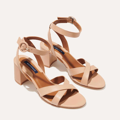The City Sandal in Rose Nappa, featuring carefully placed straps, and adjustable ankle strap and a comfortable 2.5-inch block heel.
